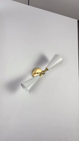 Copenhagen double cone wall sconce video showing white enamel painted cone shades, brushed brass arm and canopy, warm up-down glow, and wall-mounted installation