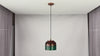 Multicolor copper drum pendant light video showing the artistic textured shade, black cord, copper canopy, warm downward glow, and kitchen island installation
