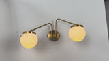 Double globe wall light video displaying warm ambient illumination for vanity lighting, bedroom walls, hallways, and contemporary interiors