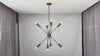 Lifestyle video showing the Celeste 8-light Sputnik chandelier with mint green holders, brass tone arms, and warm multi-directional glow in a luxury interior