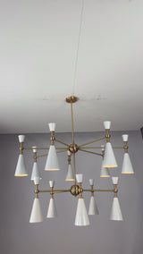 Brass Leaf Studio Celeste 12-light two-tier cone chandelier video showing white enamel painted shades, brushed brass frame, warm illumination, and luxury ceiling lighting design