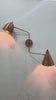 Lisbon dual shade solid brass wall sconce video showing copper patina finish, movable arms, dome and cone shades, and warm focused lighting for stylish interiors