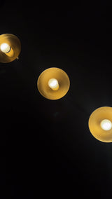 Solid brass 3-light vanity wall sconce video showing warm glow, dome reflectors, and linear wall-mounted design