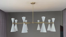 Brass and white cone chandelier slowly rotating under warm lighting, showcasing its elegant design and ambient glow in a modern interior