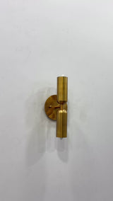 Munich cylindrical dual shade brass wall sconce video showing solid brass construction, brass patina finish, two light up down glow, and close-up wall-mounted details