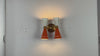 Brass Leaf Studio wall sconce video highlighting solid brass construction, perforated diabolo shades, custom color options, and warm retro glow