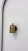 Rome cylindrical brass wall sconce video showing its rounded shade, brass patina finish, compact wall-mounted form and warm focused downward lighting