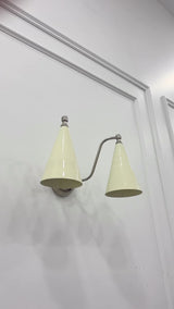 Delphi 2 light wall sconce video showing the ivory enamel cone shades, polished chrome brass arms, 15 inch width and warm downward illumination