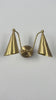 Aurelia double cone wall sconce video showing brass finish, two tapered cone shades, curved arms, warm downward glow, and elegant wall-mounted design by Brass Leaf Studio