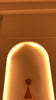 Seville brass cone wall sconce video showing the lacquer coated patina finish, curved arm, round canopy and warm focused downward illumination