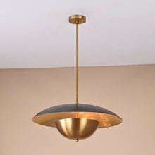 Handmade brass disc pendant light with dual dome design in raw and brushed brass finish against a neutral background
