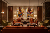 Red patterned copper pendant lamp shown illuminated with warm downward light and decorative shade texture