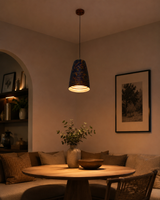 Ribbed pendant lamp shown illuminated with warm downward light for dining spaces, hallways, and entryways