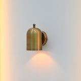 Side view of Rome wall sconce showing cylindrical shade, round wall plate and compact projection from the wall