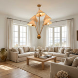 Raw brass five light chandelier with fabric shades for dining room, living room or statement interiors
