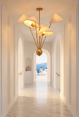 Mid century inspired brass chandelier with five fabric shades and asymmetrical multi-arm ceiling design