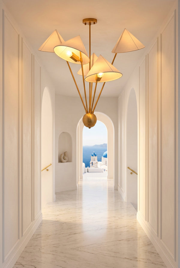 Mid century inspired brass chandelier with five fabric shades and asymmetrical multi-arm ceiling design