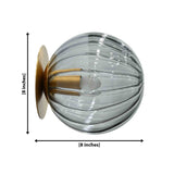Santorini ribbed glass globe wall sconce with brass patina canopy and warm glowing bulb for bedroom or hallway lighting