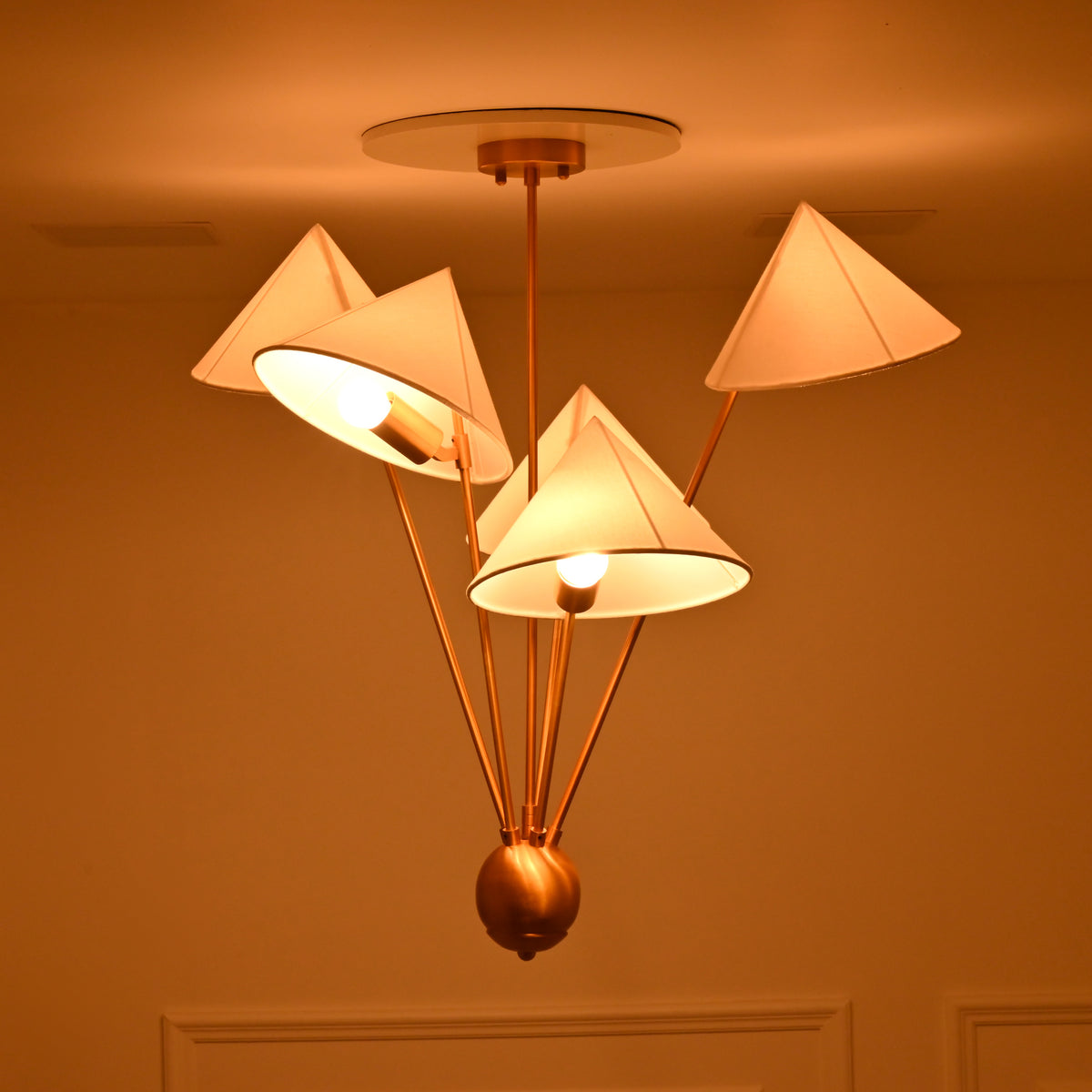 Solid brass 5 light chandelier with layered fabric shades and customizable finish and dimensions