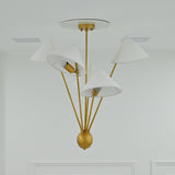 Santorini chandelier with five white fabric shades, warm brass framework and softly diffused illumination