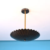 Bottom view of scalloped disc brass pendant light highlighting fluted bowl detailing