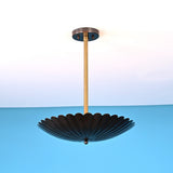 Scalloped disc brass pendant light with fluted bowl shade and brass stem in modern minimalist style