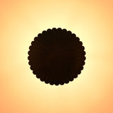 Warm glowing scalloped disc pendant light creating soft ambient ceiling illumination