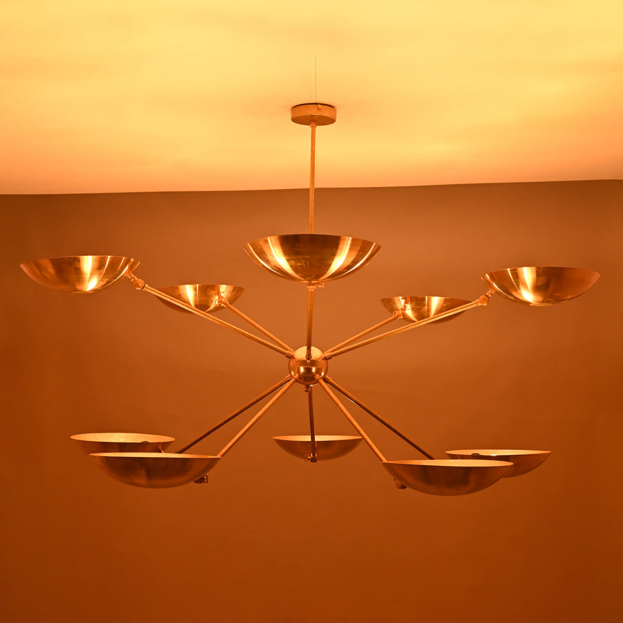 Solid brass 10-light chandelier with elegant bowl-shaped shades and balanced contemporary structure.