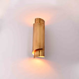 Sculptural brass wall fixture with slim vertical form for modern, luxury, and mid century interiors