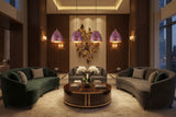 Set of four colorful copper pendant lights with black hanging cords and matching copper ceiling canopies