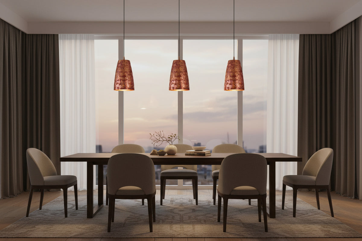 Set of four copper pendant lights with matching red patterned shades and black hanging cords for ceiling installation