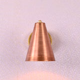 Side profile of brass wall sconce with long conical copper shade, modern industrial design