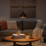 Single blue copper dome pendant lamp with rounded shade, black cord, and copper canopy on white background
