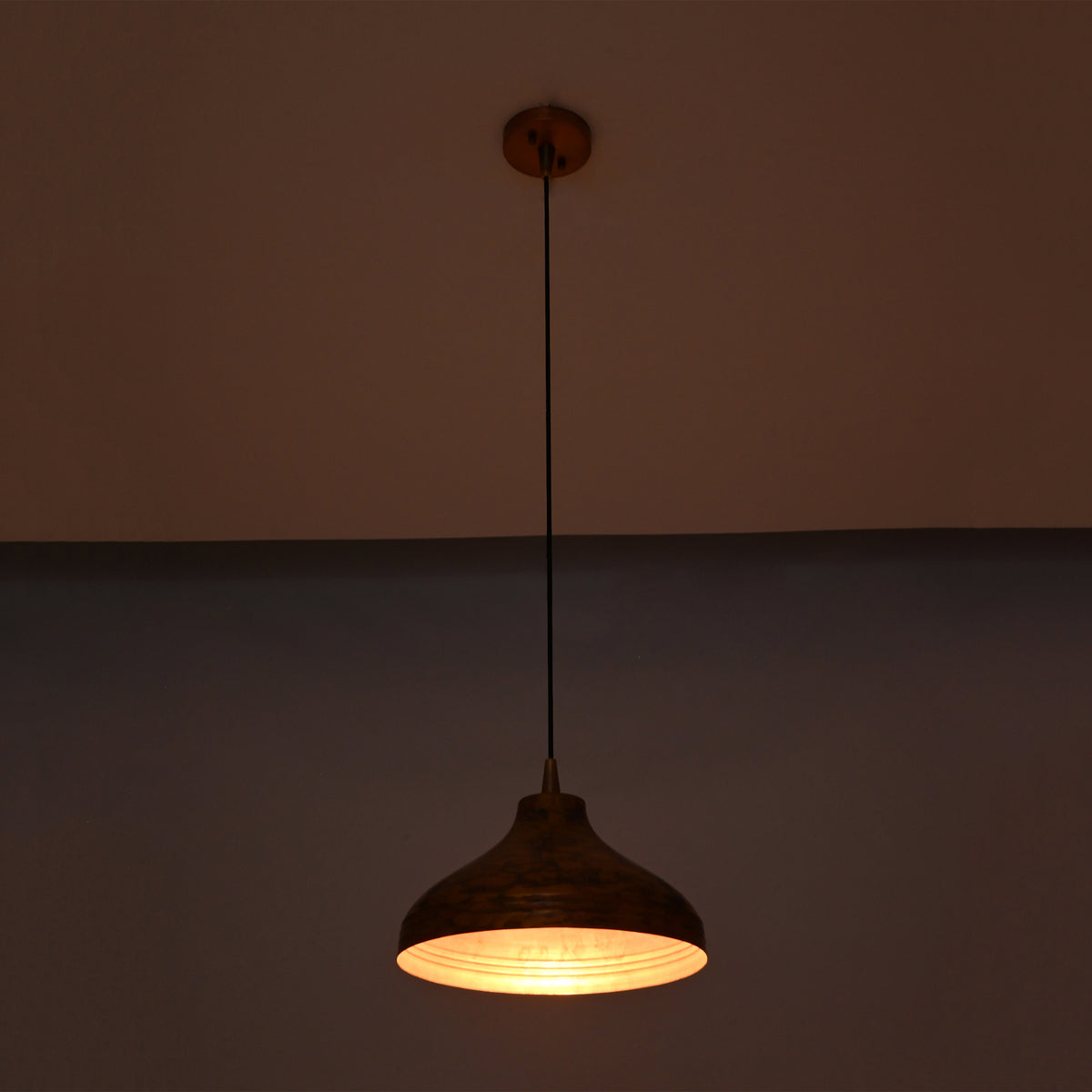 Single solid copper dome pendant with black cord and round copper canopy on a clean white background