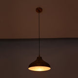 Single solid copper dome pendant with black cord and round copper canopy on a clean white background