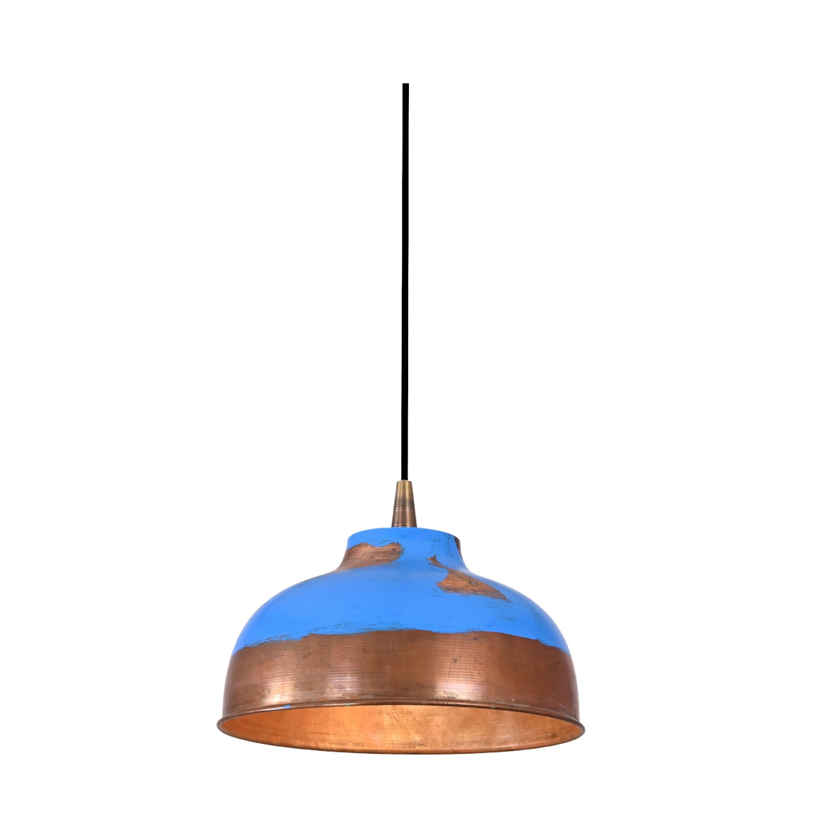 Single copper dome pendant light installed above a round dining table in a warm elegant dining room