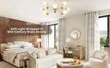 Brass globe chandelier in a bedroom with neutral tones and mid-century modern decor