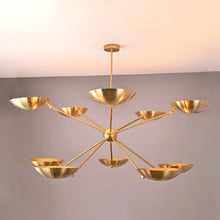 Solid brass 10-light chandelier with elegant bowl-shaped shades and balanced contemporary structure.