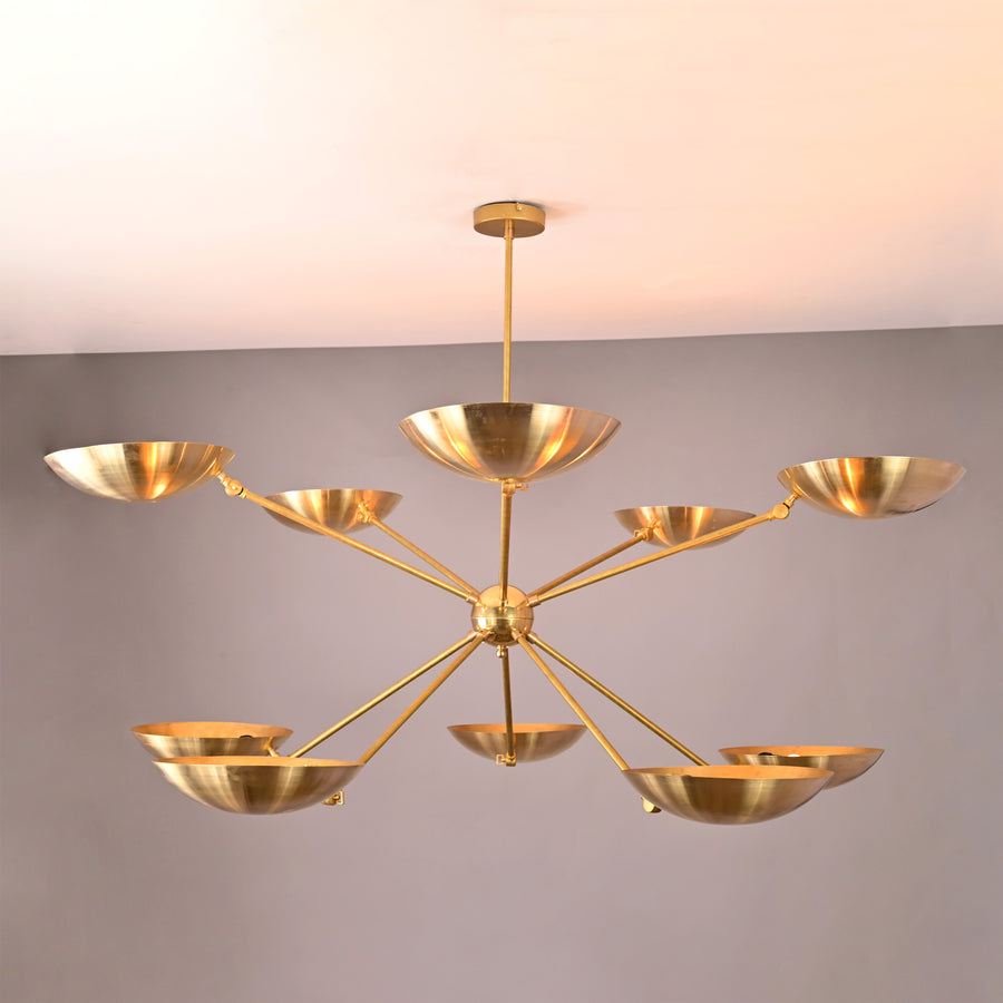 Solid brass 10-light chandelier with elegant bowl-shaped shades and balanced contemporary structure.