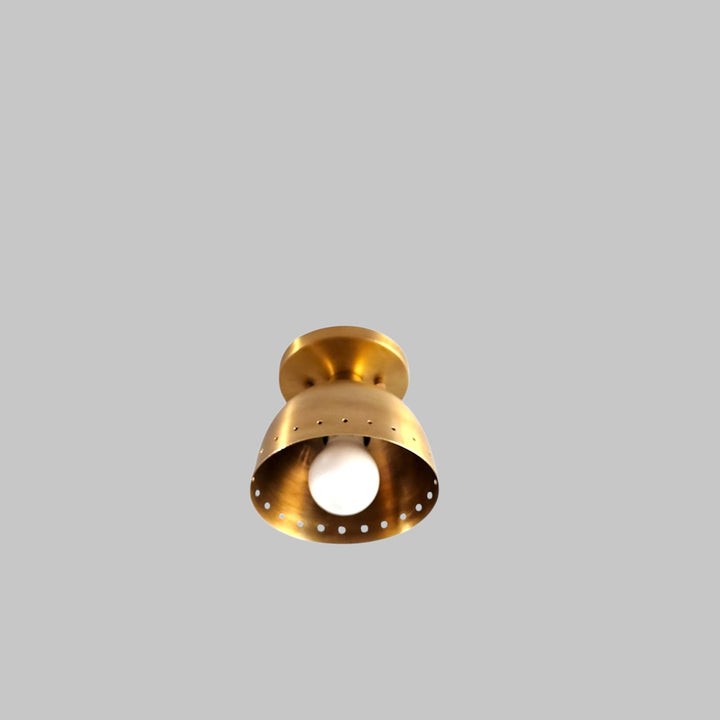 Handcrafted solid brass ceiling lamp featuring perforated detailing and warm ambient glow