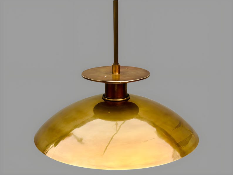 Top view detail of solid brass bowl pendant light showing handcrafted brass canopy and lacquered finish