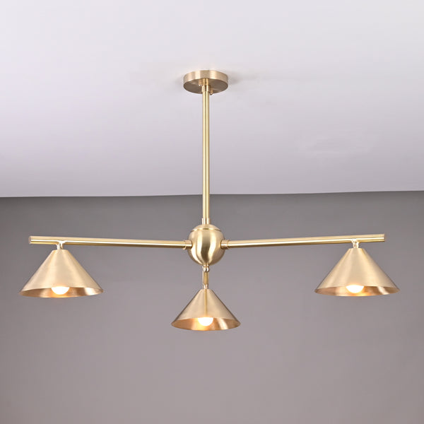 Modern solid brass chandelier with three cone-shaped shades, brushed finish, handcrafted for contemporary interior lighting.