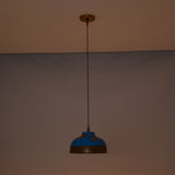 Solid copper dome pendant light hanging above a bedroom with warm ambient lighting and decorative style