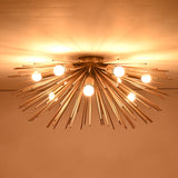 Mid century brass starburst chandelier creating dramatic warm ambient lighting in dark setting