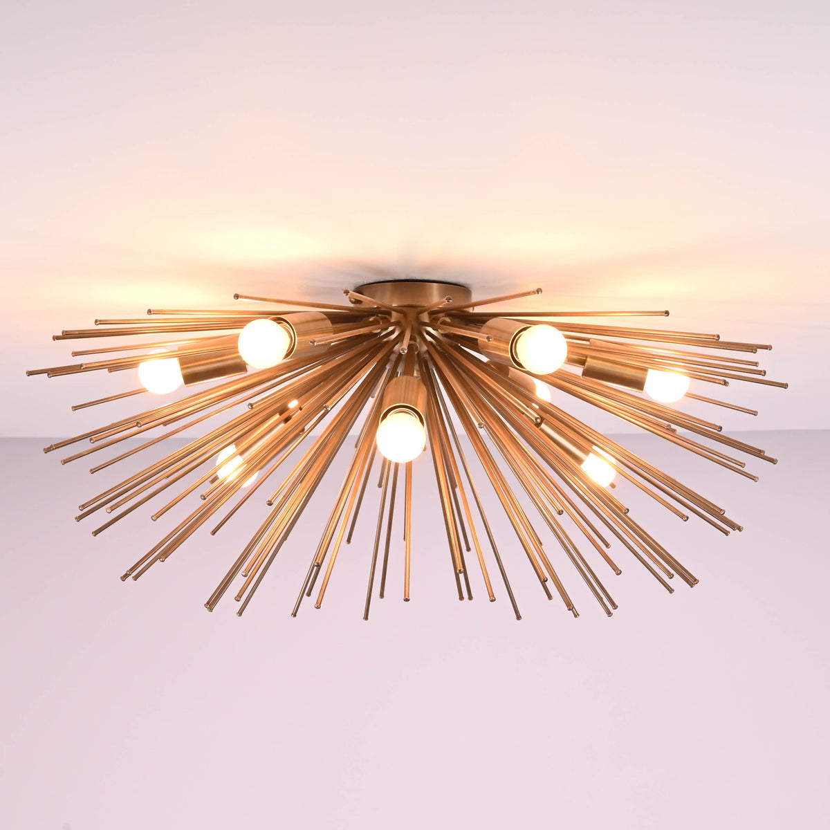 Modern sunburst flushmount chandelier in solid brass with multiple bulbs and radiating rods