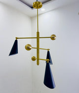 Modern ceiling-mounted three cone brass chandelier designed for ambient lighting in contemporary living spaces.