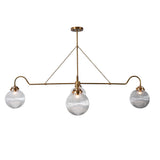 Four-light brass linear chandelier with ribbed glass globes and minimalist suspended design, ideal for modern dining and kitchen spaces.