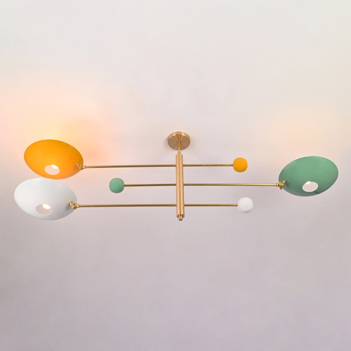 Three light multicolor bowl flush mount ceiling light in solid brass with sculptural horizontal arms