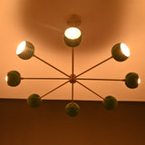 Top view of illuminated chandelier casting soft glow on ceiling