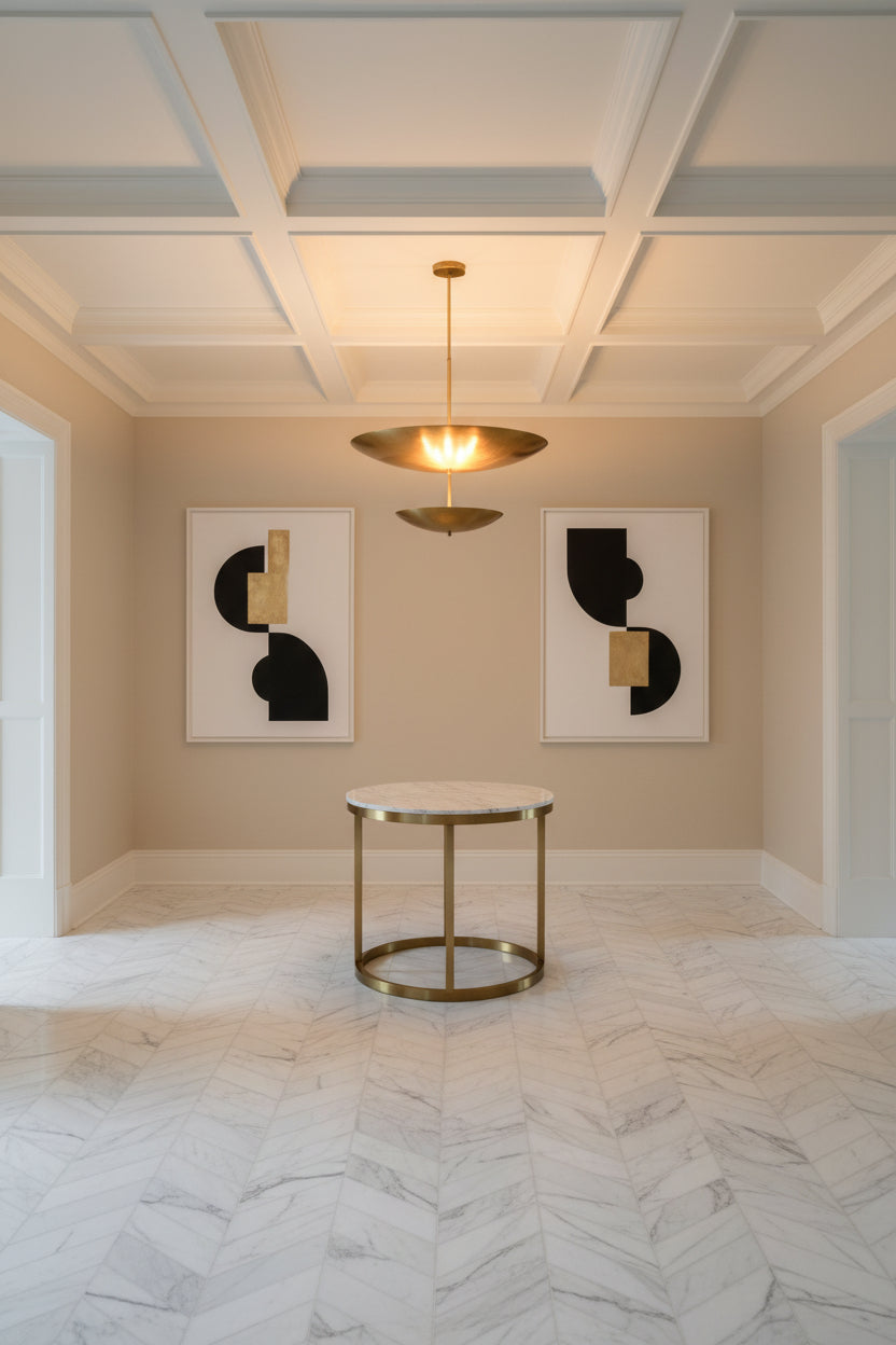 Two-tier brass pendant light with slim downrod, round canopy, and sculptural layered disc profile